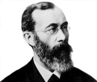 Black-and-white portrait of Wilhelm Wundt, a bearded man wearing glasses.
