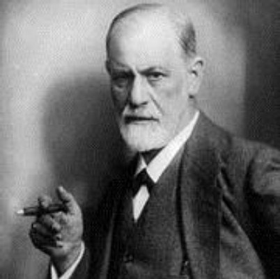 Formal portrait of Sigmund Freud holding a cigar.